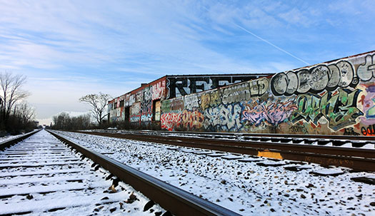 graffitied walls alongside a track in Detroit