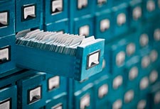 a card catalog with an open drawer