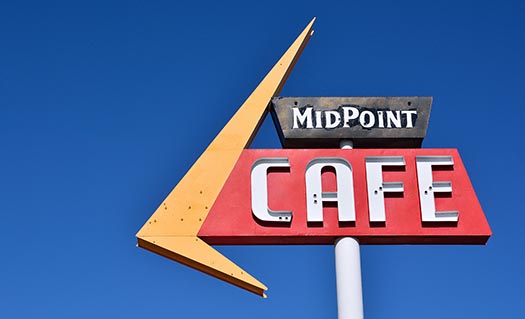 a sign for a diner called the midpoint cafe