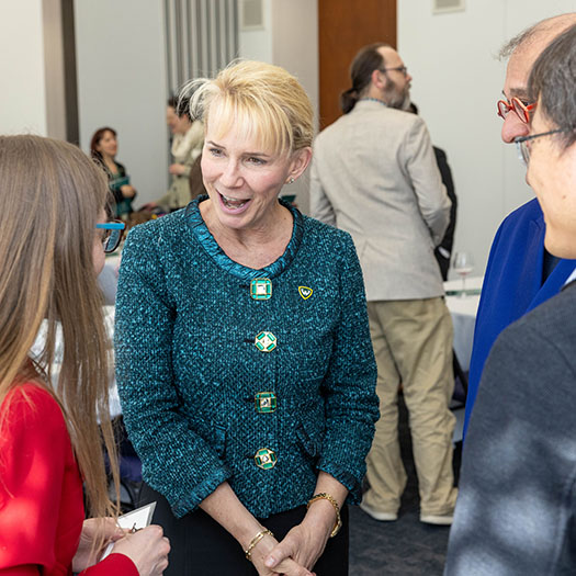 President Espy converses with faculty and academic staff at the 2024 Academic Recognition Ceremony